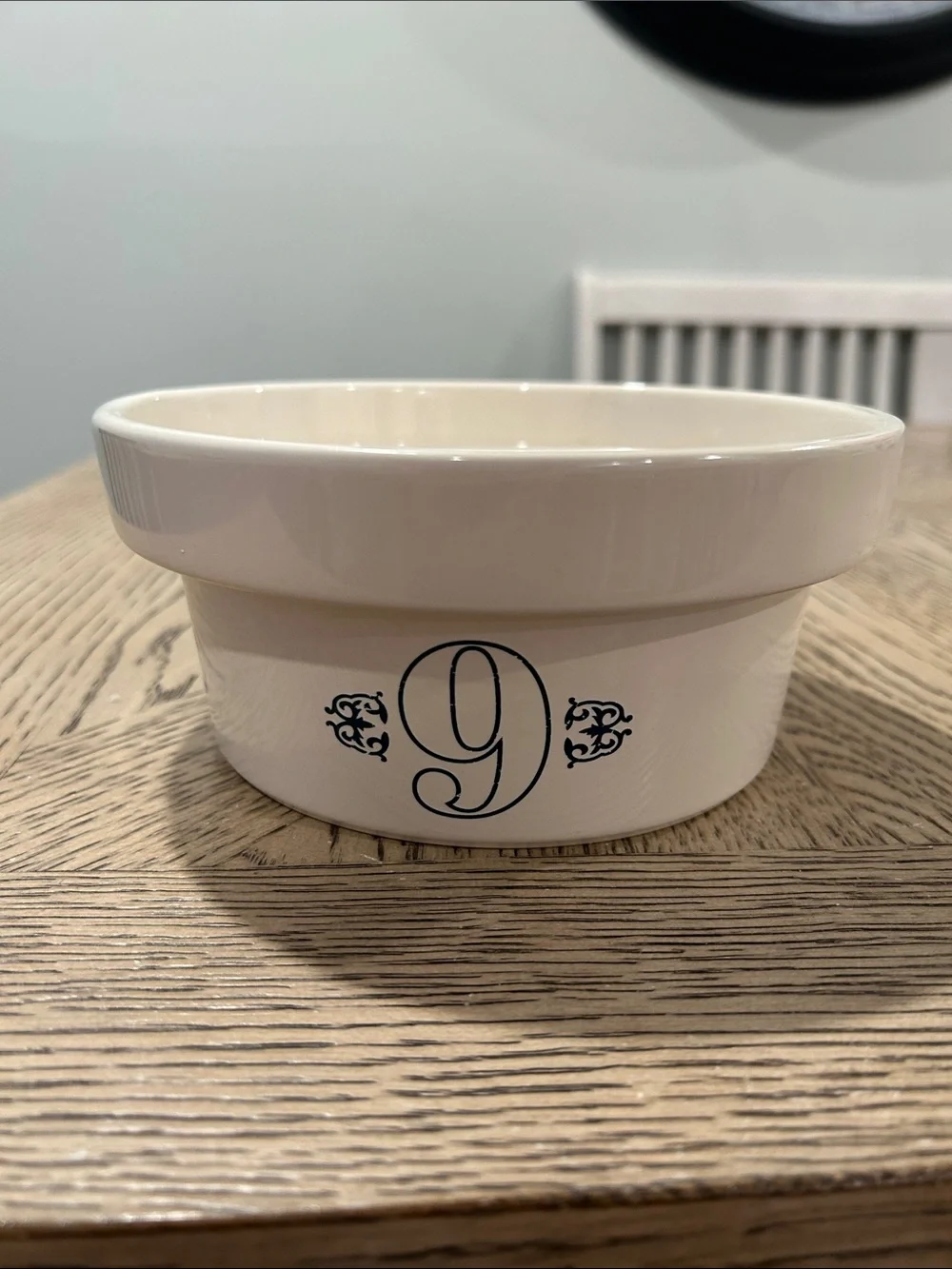 Pottery Barn Cream Ceramic dog bowl with Blue Logo